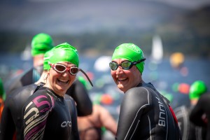 women with swim hats and googles on