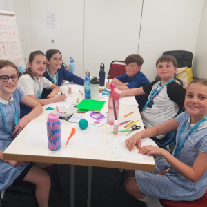 school children round a table