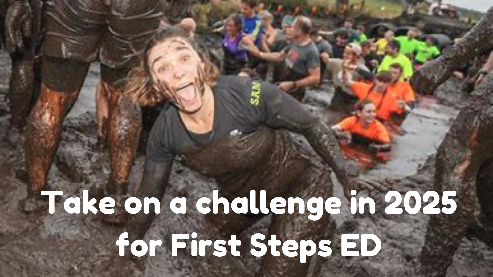 woman covered in mud from obstacle course race