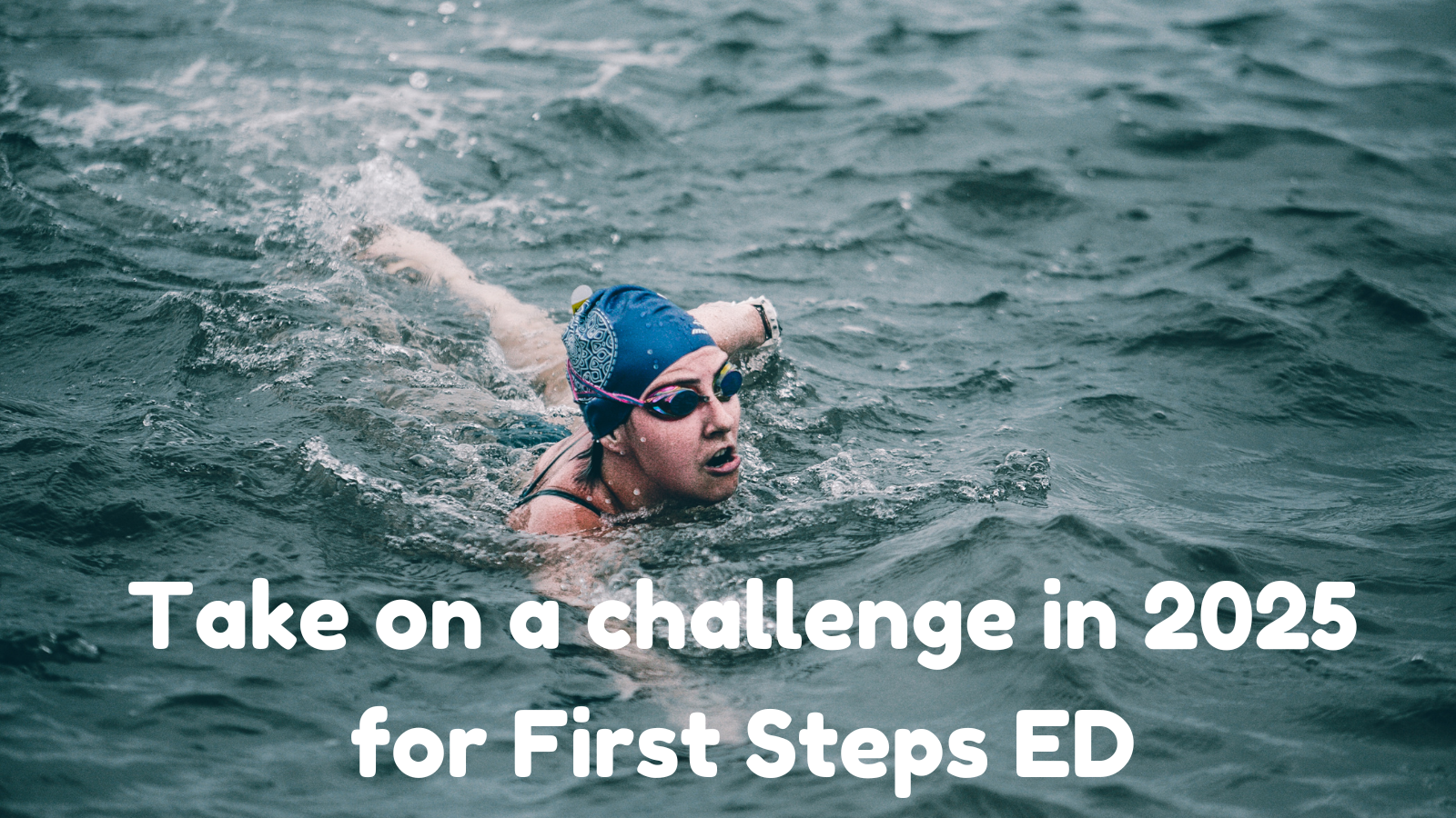 woman open water swimming with hat and googles on