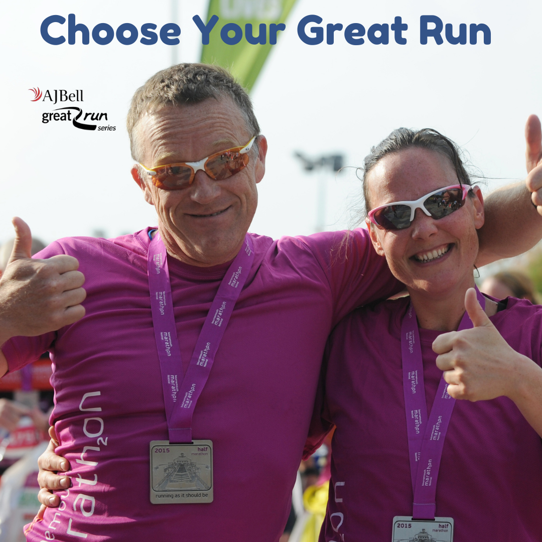 man and woman doing thumbs up in purple tshirts